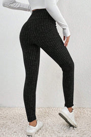 Textured knit leggings in black with a ribbed pattern and high waist.