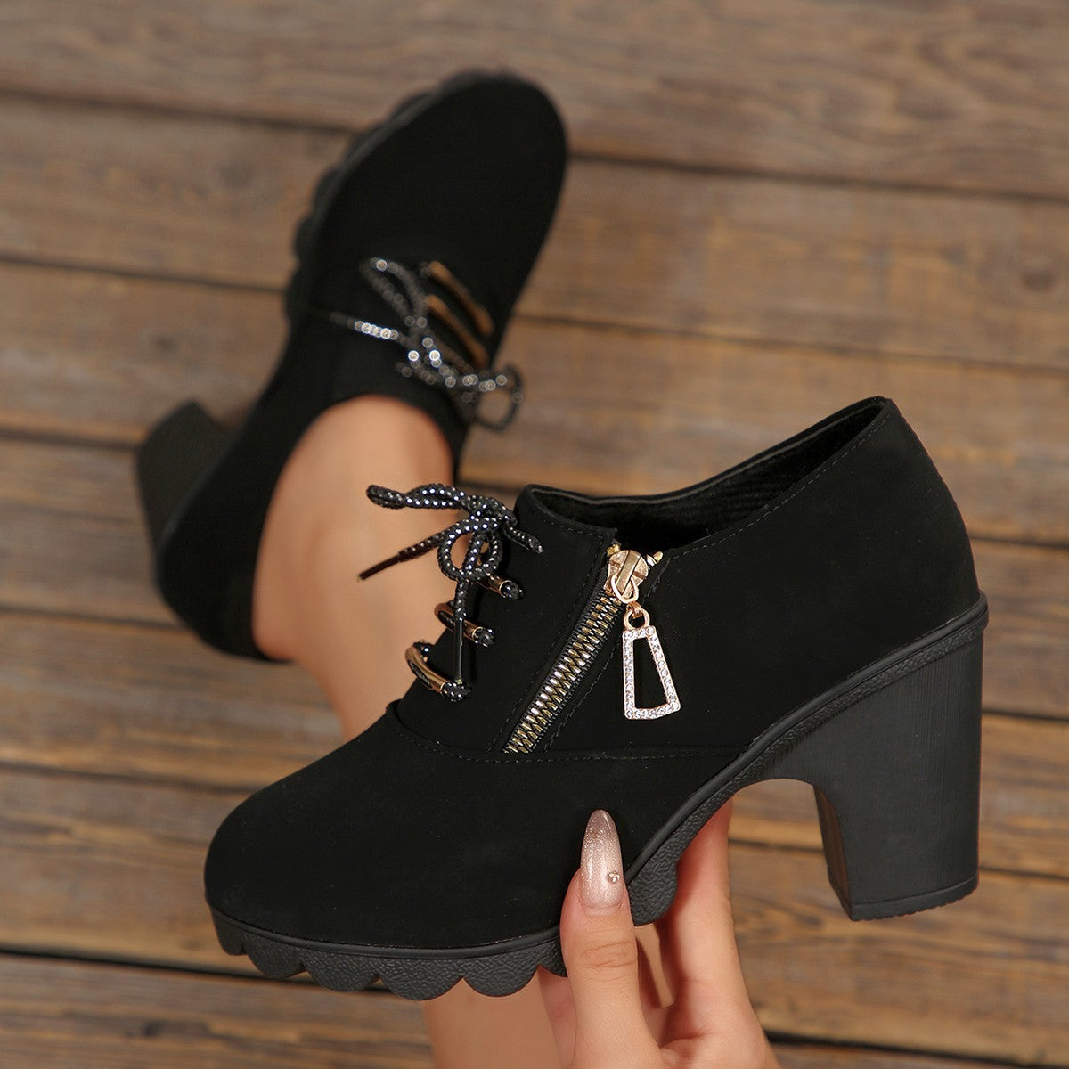 Black lace-up high heel pumps with side zipper and chunky block heel.