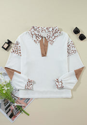 White waffle knit polo with leopard print collar and sleeves