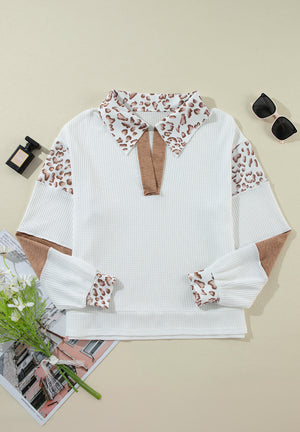 White waffle knit polo with leopard print collar and sleeves