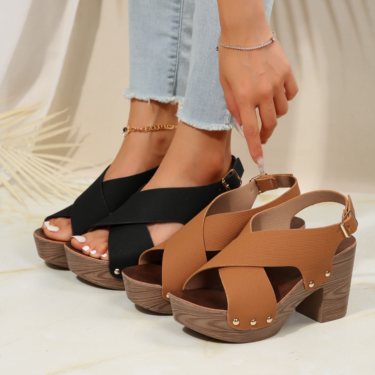 Crisscross high heel sandals in black and brown with stud details and block heel.