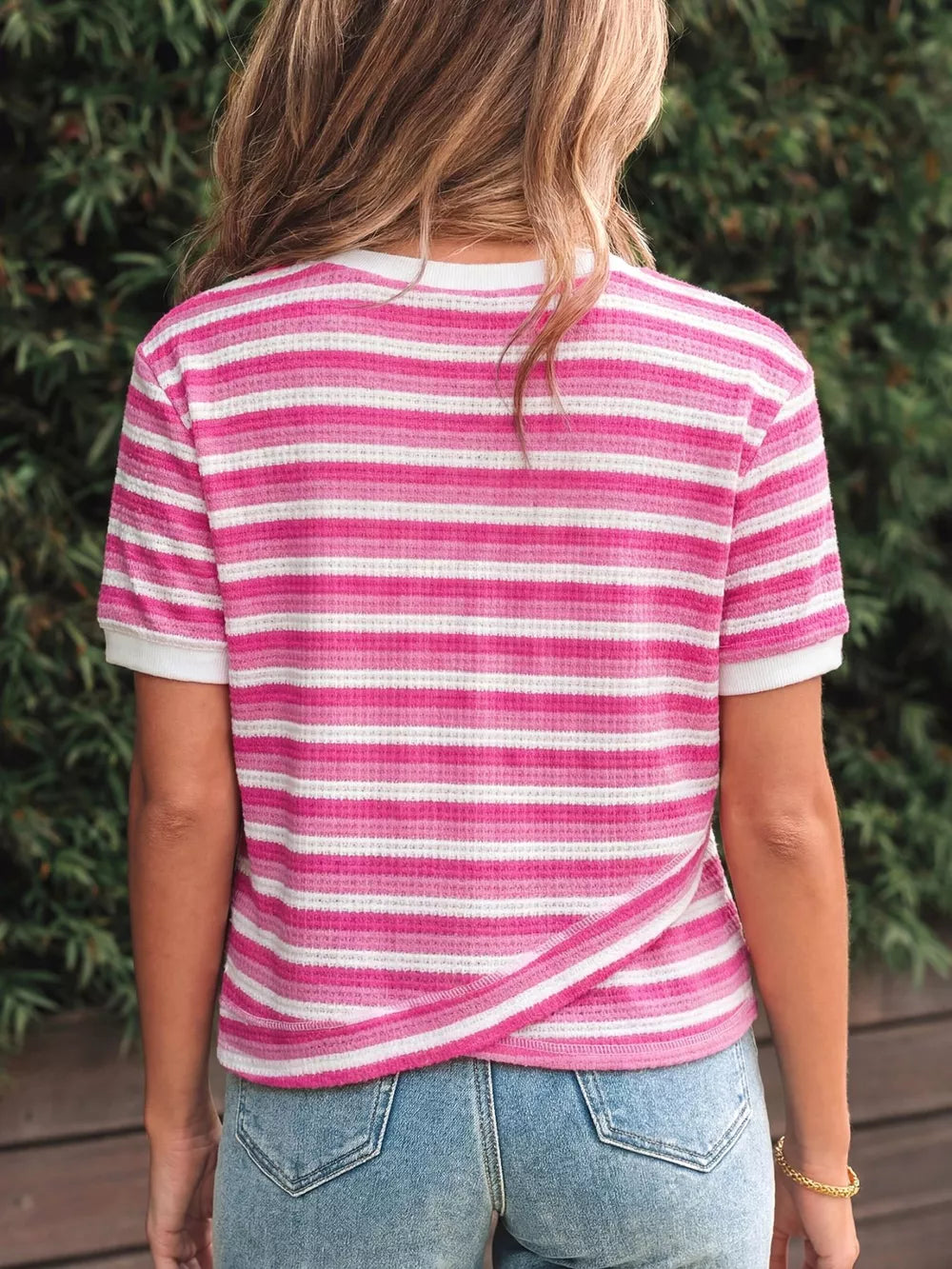 Textured knit tee with pink and white stripes and crossed detail at the back.