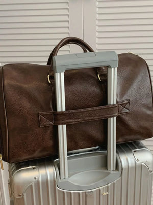 Brown faux leather travel organizer bag with top handles and a detachable strap.