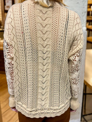 Tan lace sleeve knit cardigan with open knit details and textured back panel.