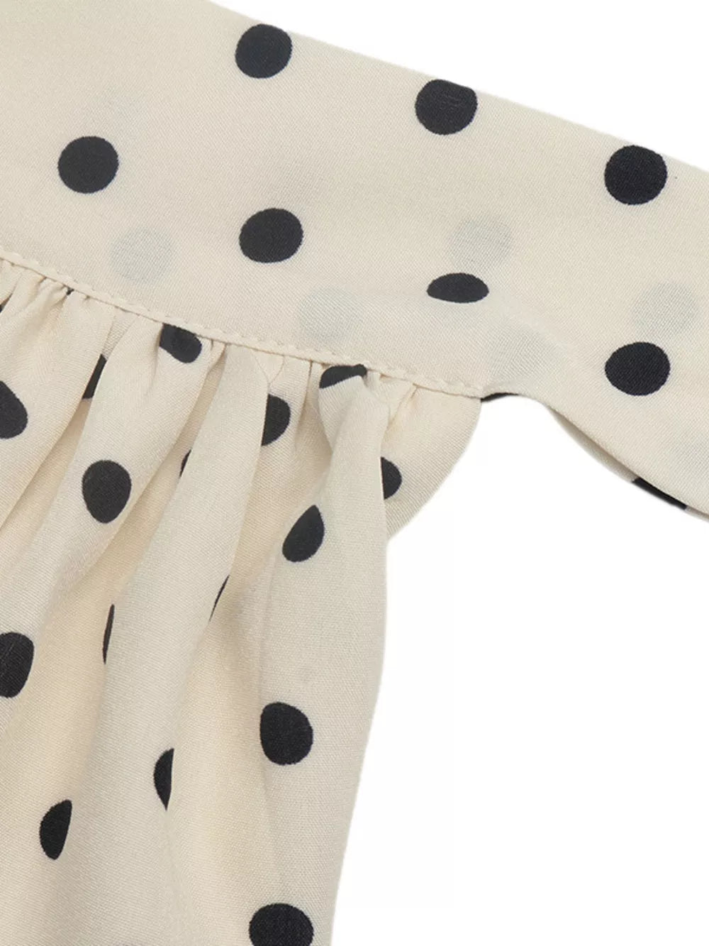 Apricot polka dot halter mini dress with ruffled detail