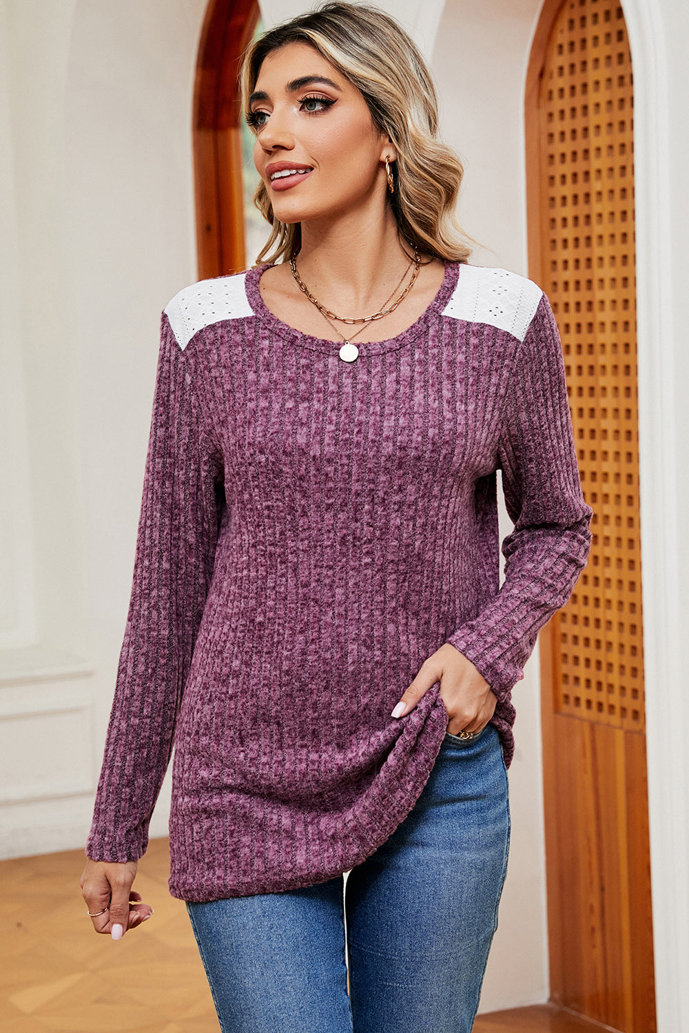 Lilac ribbed knit top with eyelet shoulder detail and crew neck.