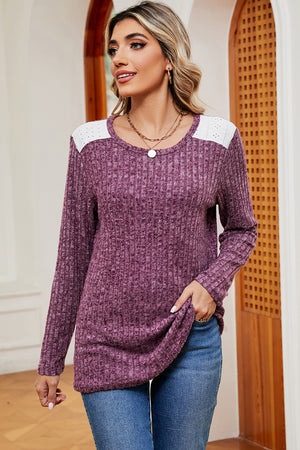 Lilac ribbed knit top with eyelet shoulder detail and crew neck.