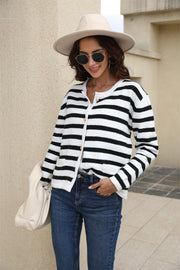 Black/White A striped crewneck cardigan with button front and gold buttons.