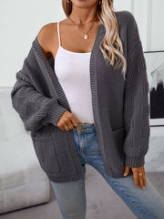 Chunky knit open-front cardigan in dark gray with pockets and textured sleeves.