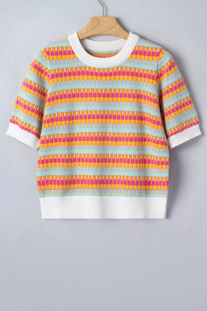 Vibrant abstract knit sweater with crew neck, short sleeves, and white ribbed trim.