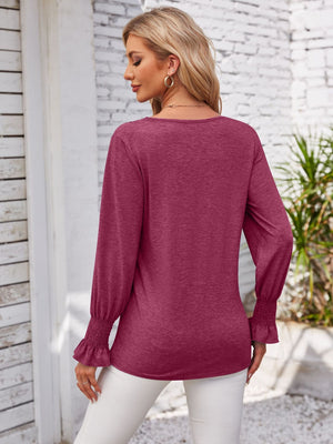 Maroon lace trim v-neck blouse with blouson sleeves and ruffled cuffs.