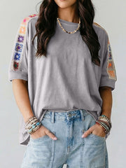 Grey t-shirt with colorful crochet detail on sleeves, loose fit, casual style.