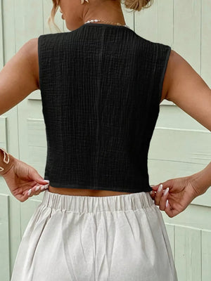 Textured black cropped button vest with a crinkled cotton fabric.