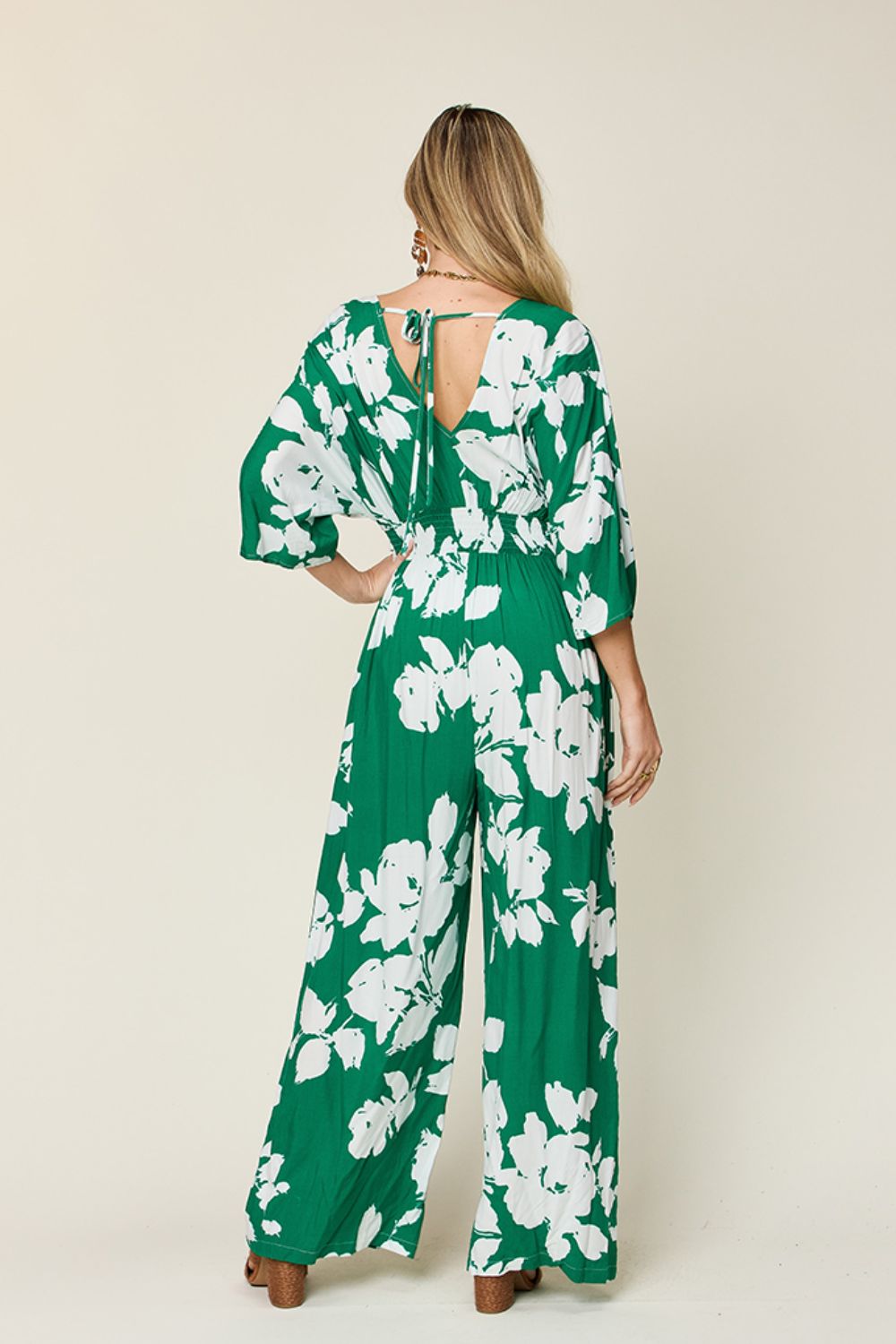 Green floral kimono jumpsuit with wide legs and tie-back detail