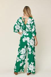 Green floral kimono jumpsuit with wide legs and tie-back detail