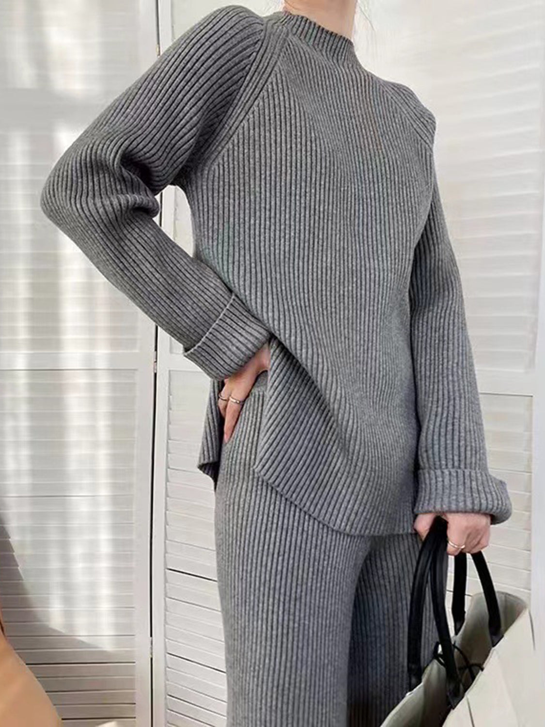 Dark Gray ribbed knit co-ord set with asymmetric hem and cuffed sleeves.
