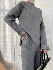 Dark Gray ribbed knit co-ord set with asymmetric hem and cuffed sleeves.