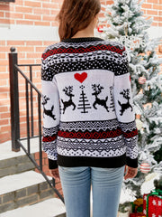 White acrylic crewneck sweater with black and red Fair Isle reindeer and heart pattern.