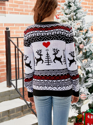 White acrylic crewneck sweater with black and red Fair Isle reindeer and heart pattern.