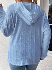 Light blue textured knit raglan hoodie with diamond cable pattern.