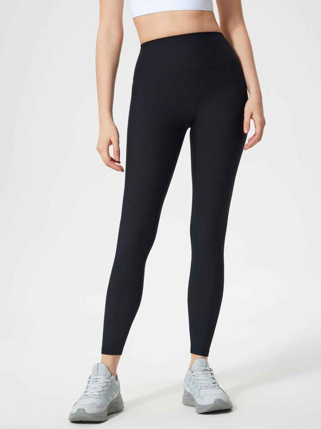 Black ribbed high-waist leggings with a full-length cut.