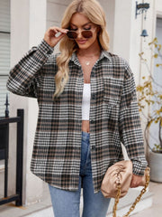 Oversized plaid shirt jacket in brown, black, and white with a chest pocket.