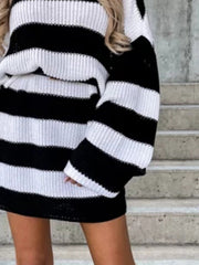 Black and white stripe oversized knit mini dress with long sleeves.