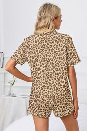 Pajama set with leopard print in camel and brown, short sleeves, and white piping.