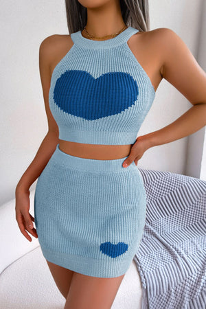 Sky blue knit halter crop top and mini skirt set with intarsia heart details.