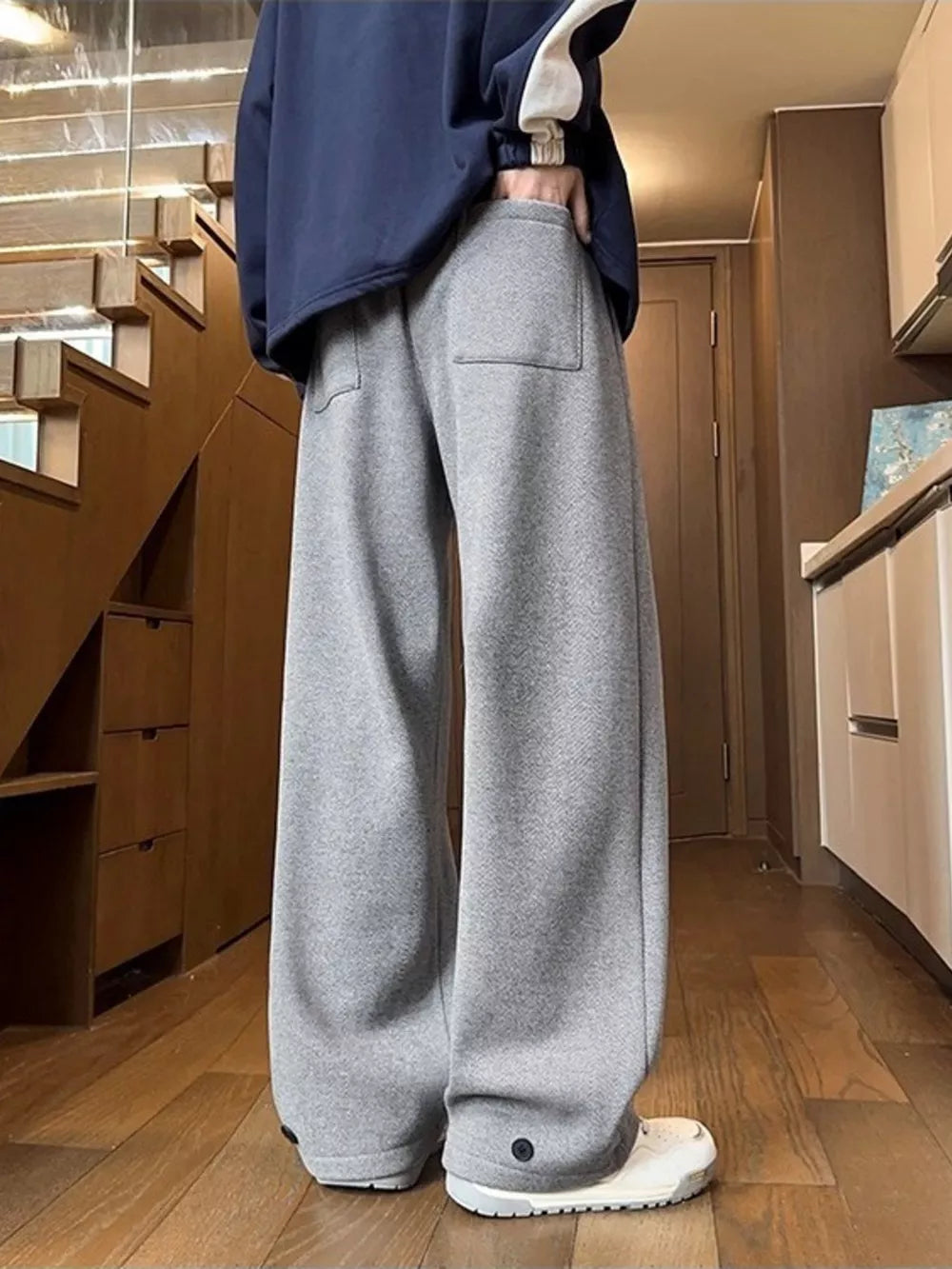 Relaxed fit grey herringbone sweatpants with ankle cuffs and a back pocket.