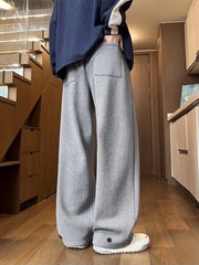 Relaxed fit grey herringbone sweatpants with ankle cuffs and a back pocket.