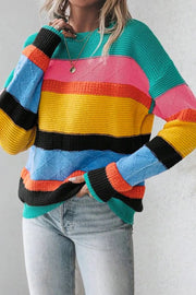 Rainbow stripe knit crewneck sweater with diamond pattern detail.