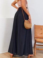 Black gathered waist wide-leg palazzo maternity pants with a flowy cut.