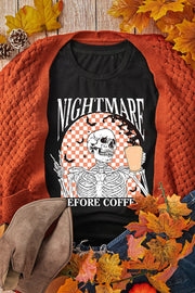 Black graphic t-shirt with skeleton holding coffee and bats, text Nightmare Before Coffee
