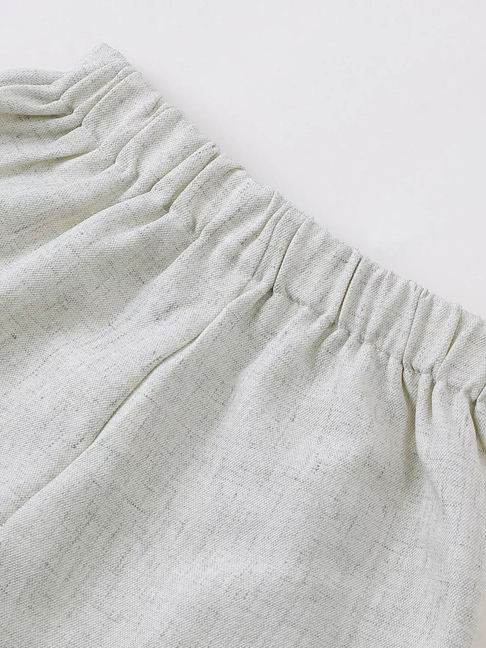 Baby shorts with elastic waistband in light grey textured fabric