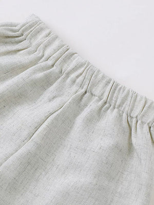 Baby shorts with elastic waistband in light grey textured fabric