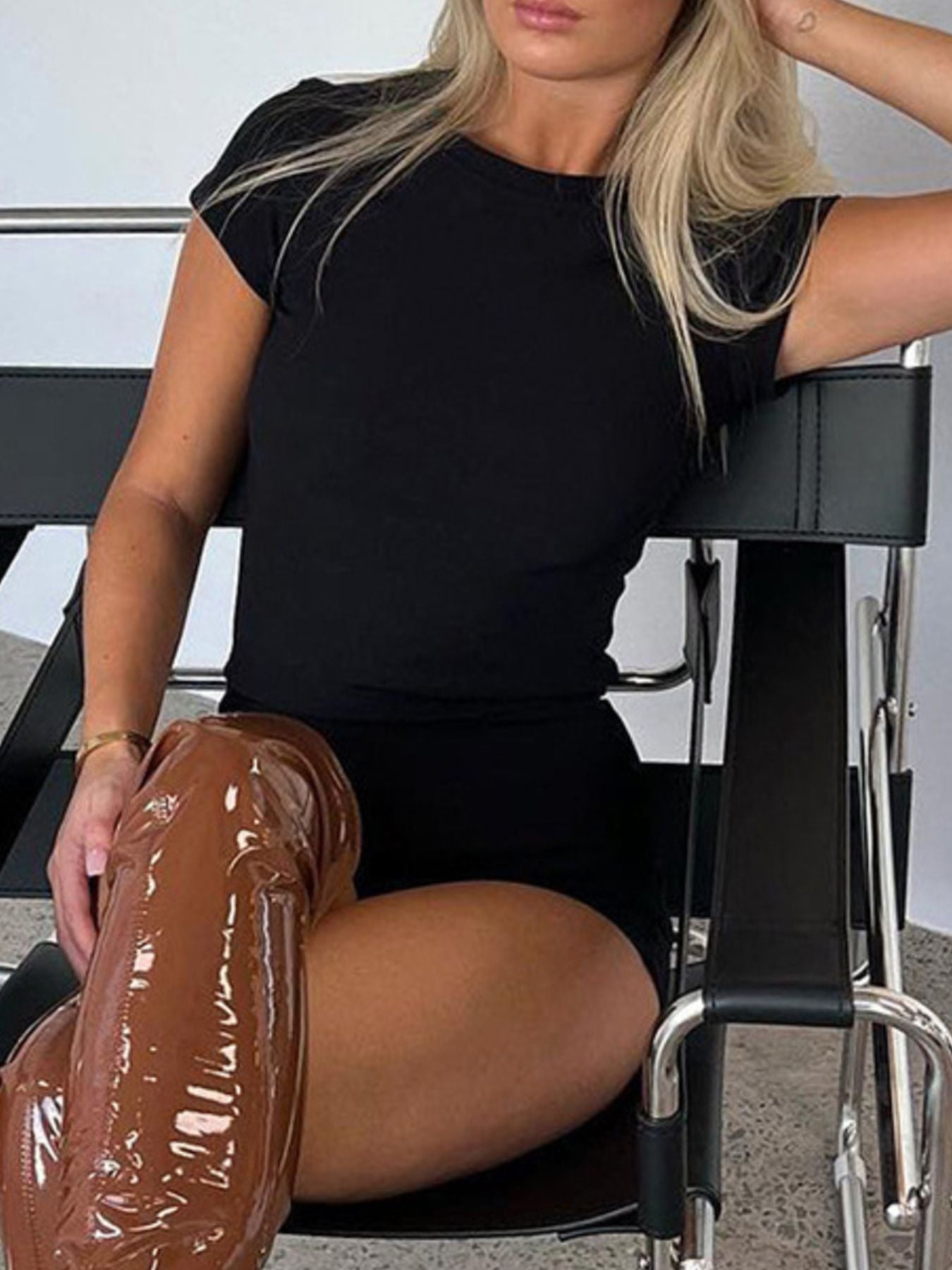 Black ribbed two-piece tee and shorts set with short sleeves and crew neck.