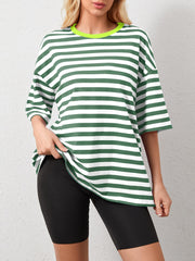 Oversized striped tee in dark green and white with dropped sleeves and a neon green neckline.