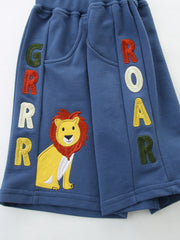 Toddler shorts with lion embroidery and GRRR ROAR lettering.