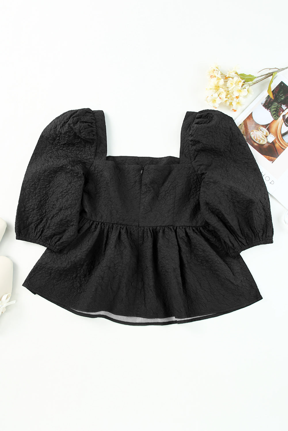 Black textured peplum blouse with square neck and petal puff sleeves