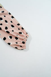Blouson sleeve blouse in dust storm pink with black spot print and elastic cuff.