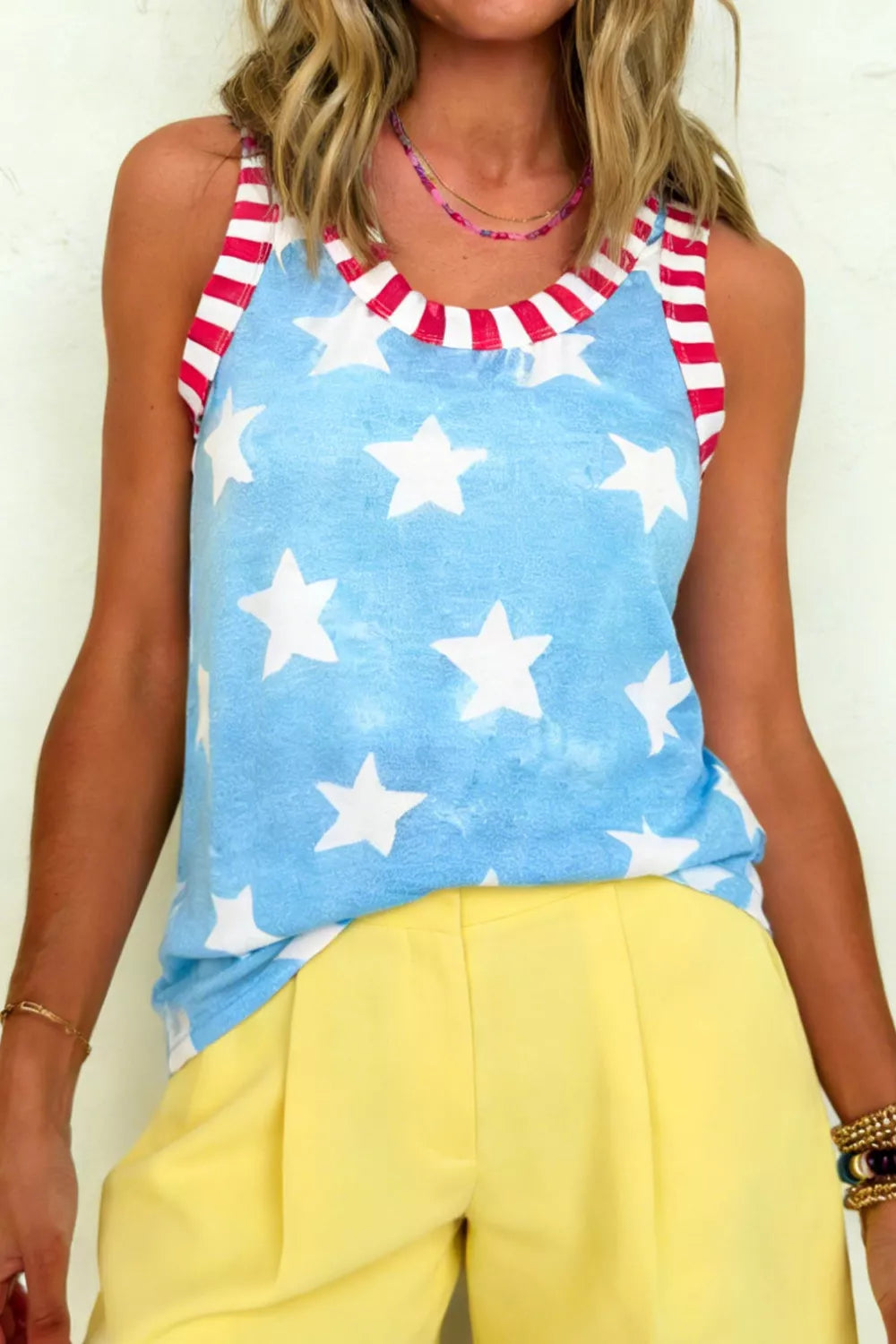 Tank top with blue tie-dye star print and red striped trim