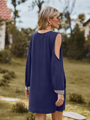 Navy cold shoulder mini dress with lace trim on cuffs and open shoulders.