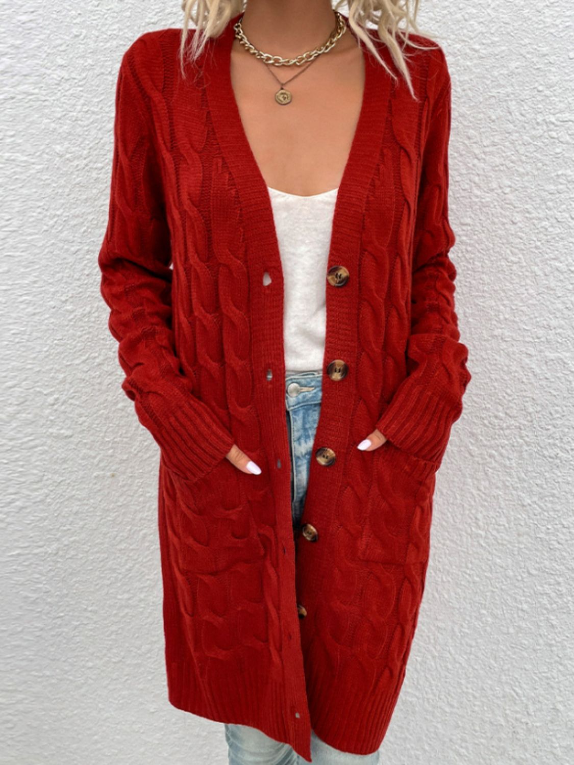 Deep Red cable knit button-down cardigan with pockets and wooden buttons.