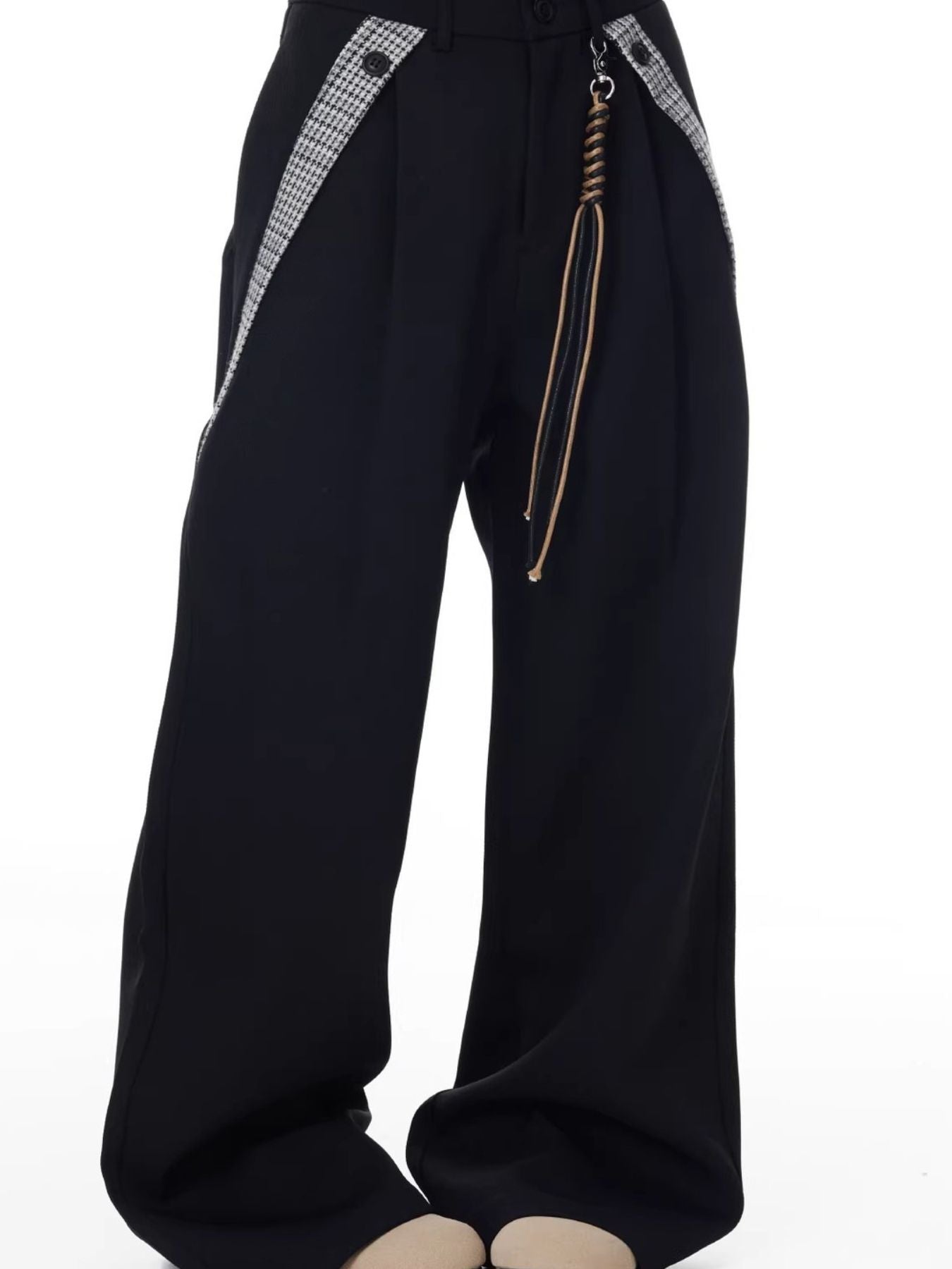 Men's black wide-leg cotton trousers with braided cord detail and houndstooth trim.