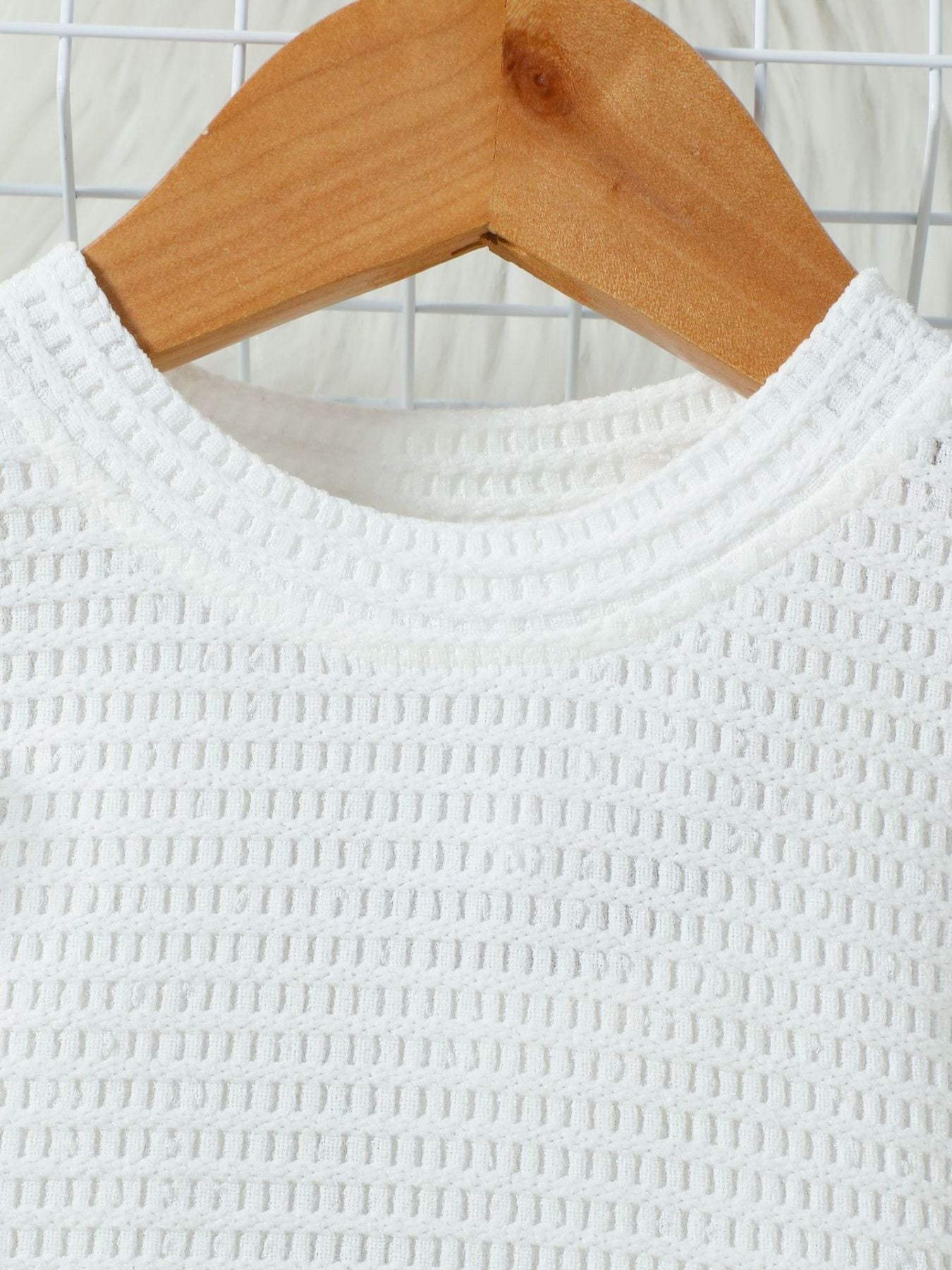 White textured knit top with crew neck detail