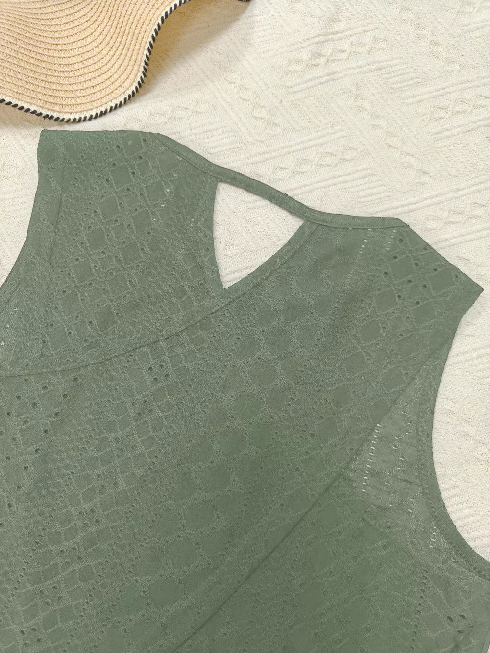Army green openwork knit tank top with cutout detail and crew neck.
