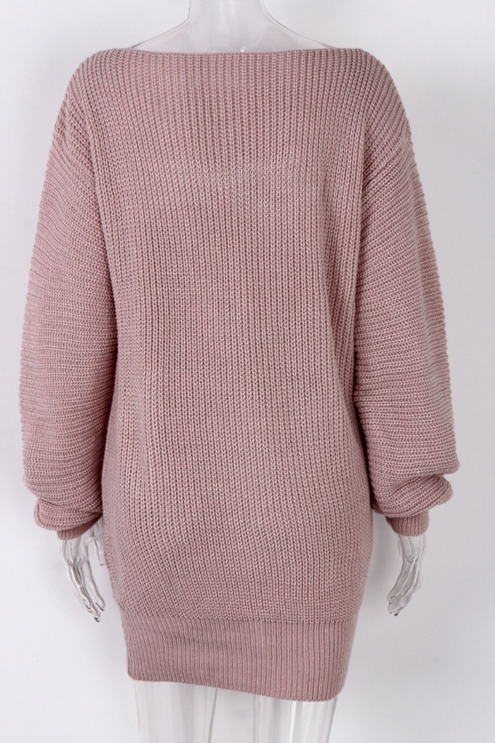 Blush pink ribbed knit mini dress with off-the-shoulder neckline and long sleeves.