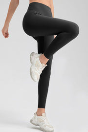 Women's black high-waisted sculpted contour leggings with a seamless design.