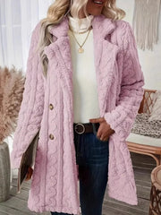 Pink faux shearling double-breasted overcoat with cable knit texture and button closure.